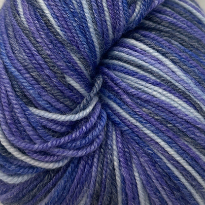 Blue and white striped yarn skein on a white background