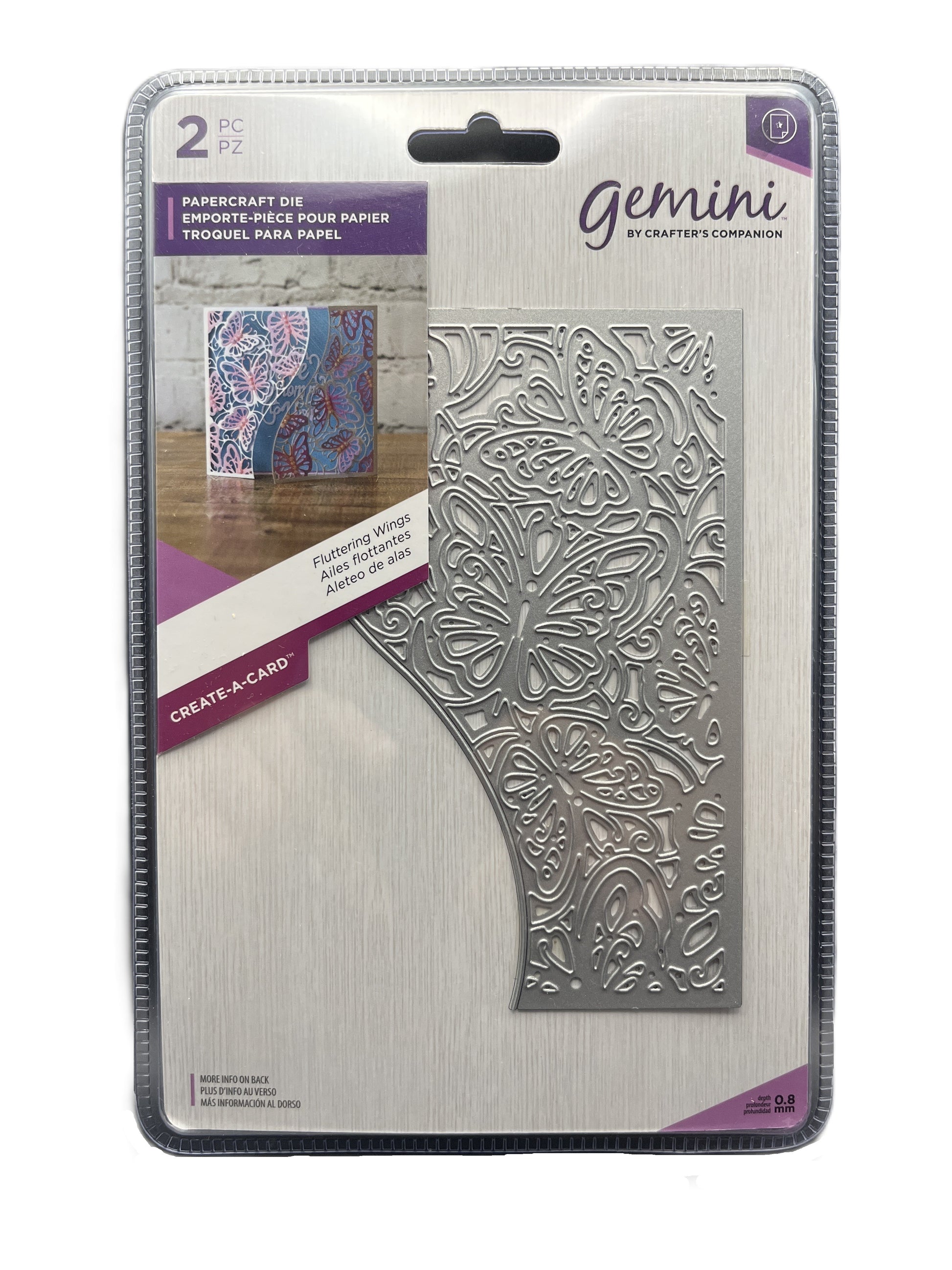 Metallic die with intricate design on a Gemini packaging