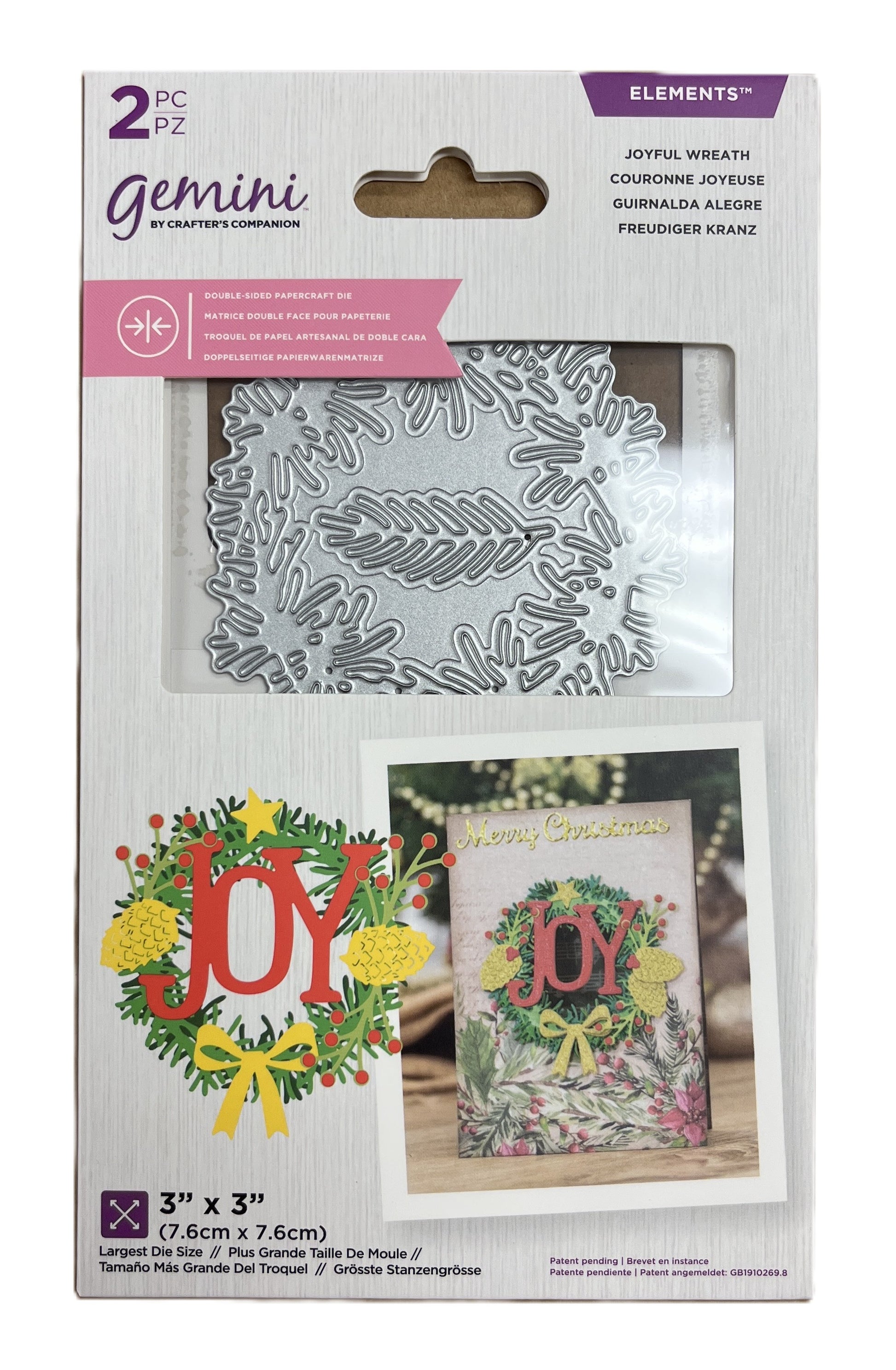Packaging of Gemini Dies with wreath and 'JOY' design on a white background