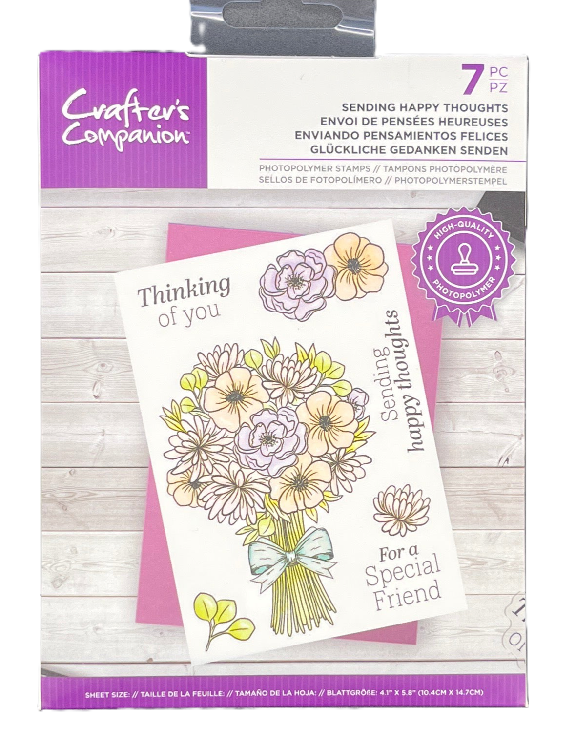 Packaging of Crafter's Companion card with floral design and text on a wooden surface
