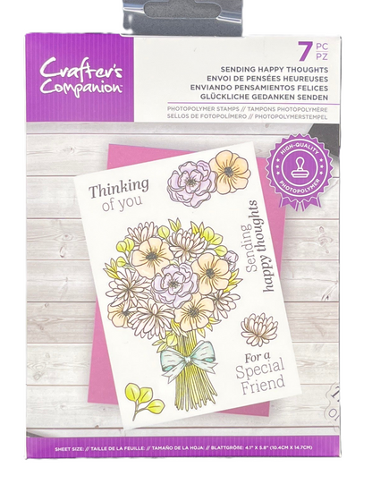 Packaging of Crafter's Companion card with floral design and text on a wooden surface