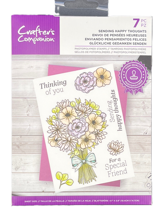 Packaging of Crafter's Companion card with floral design and text on a wooden surface