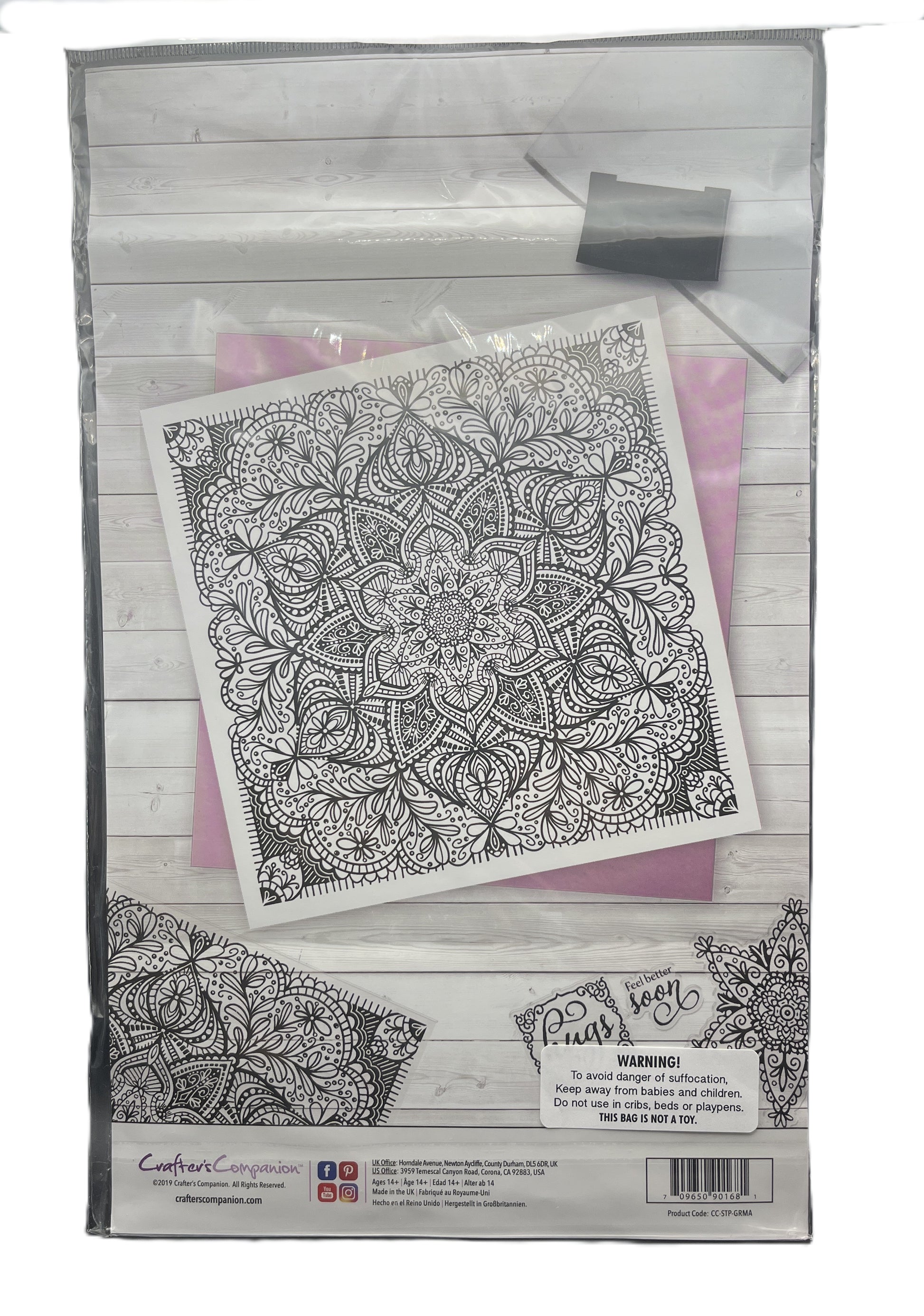Clear plastic packaging with a mandala design on a pink background