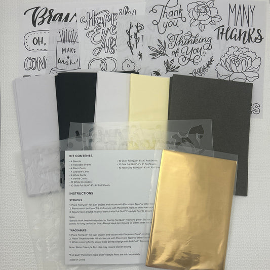 Collection of stationery items including cards and a stamp set on a white surface.