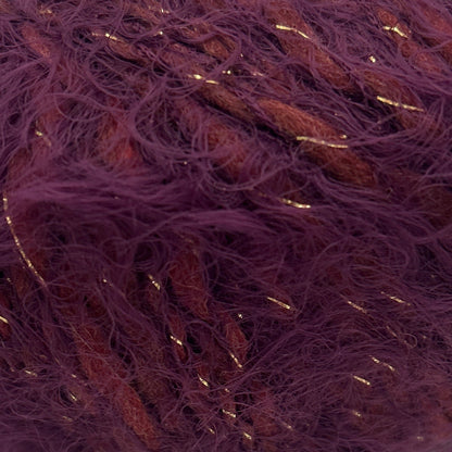 Purple yarn ball with gold threads on a white background