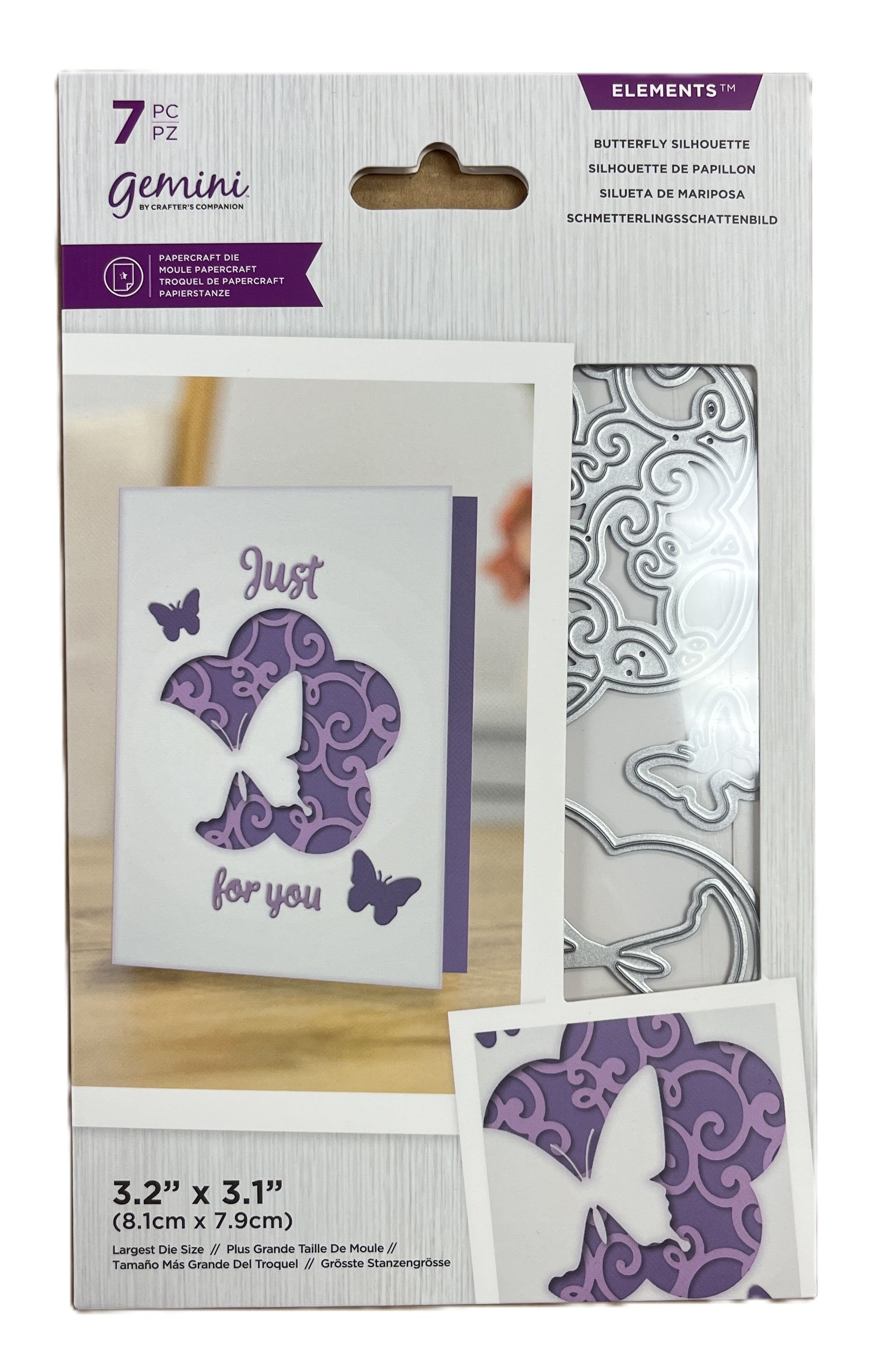 Packaging of Gemini butterfly silhouette cutting dies with a card and die on a wooden surface.