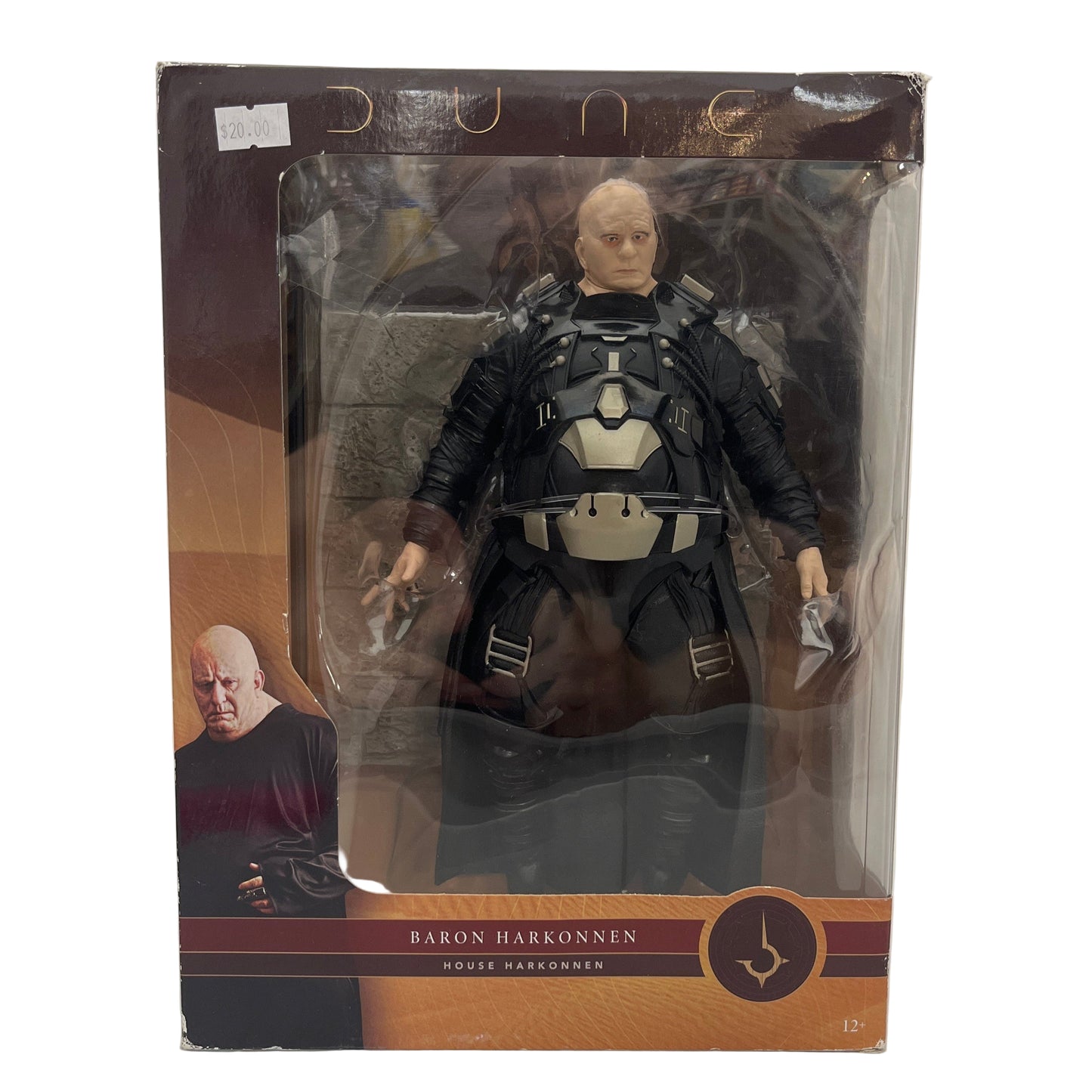 Action figure in packaging with 'Dune' branding on a white background
