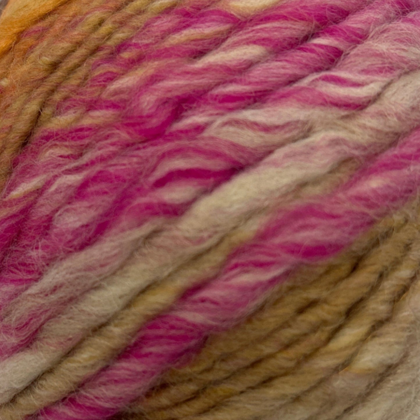 Ball of multicolored yarn on a white background