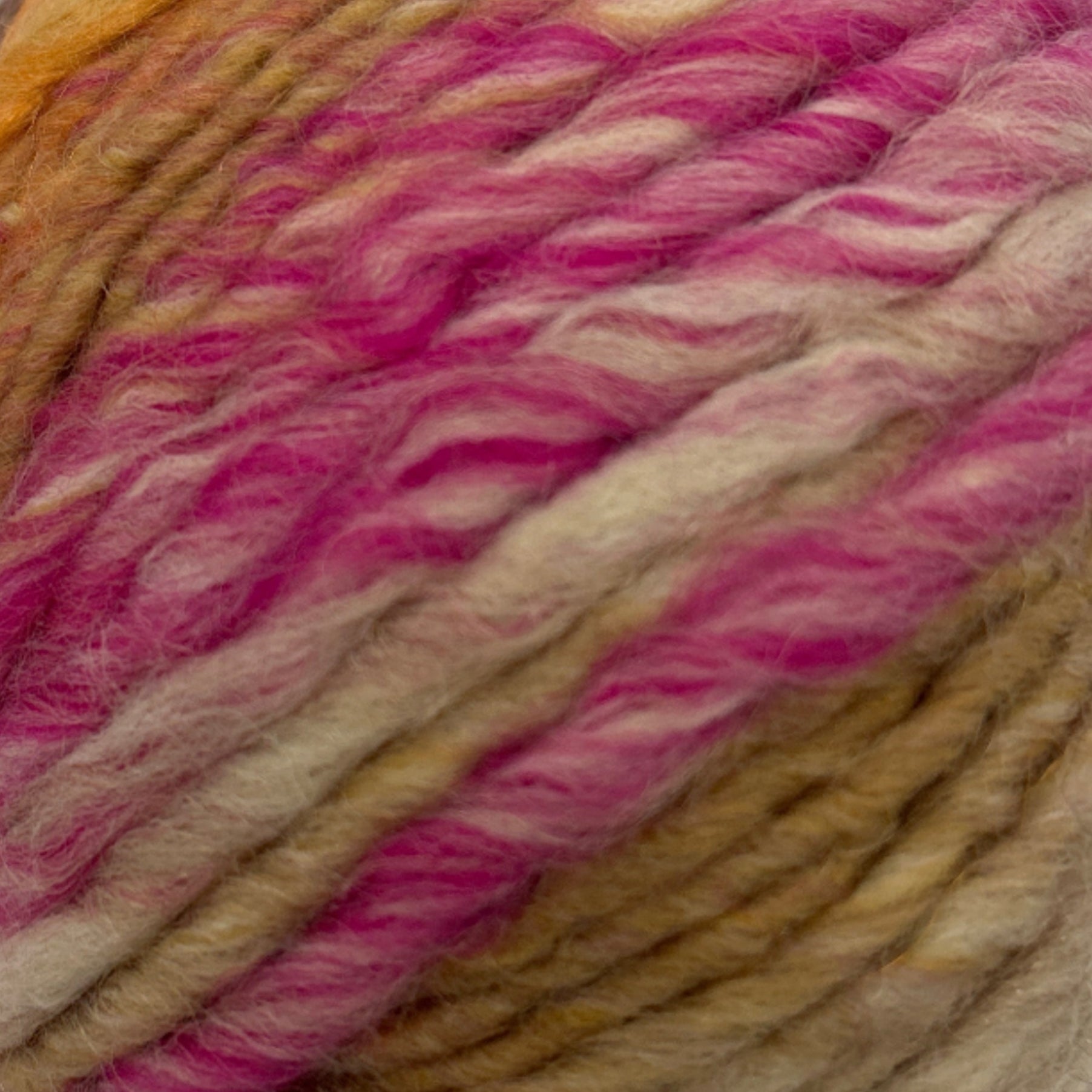Ball of multicolored yarn on a white background