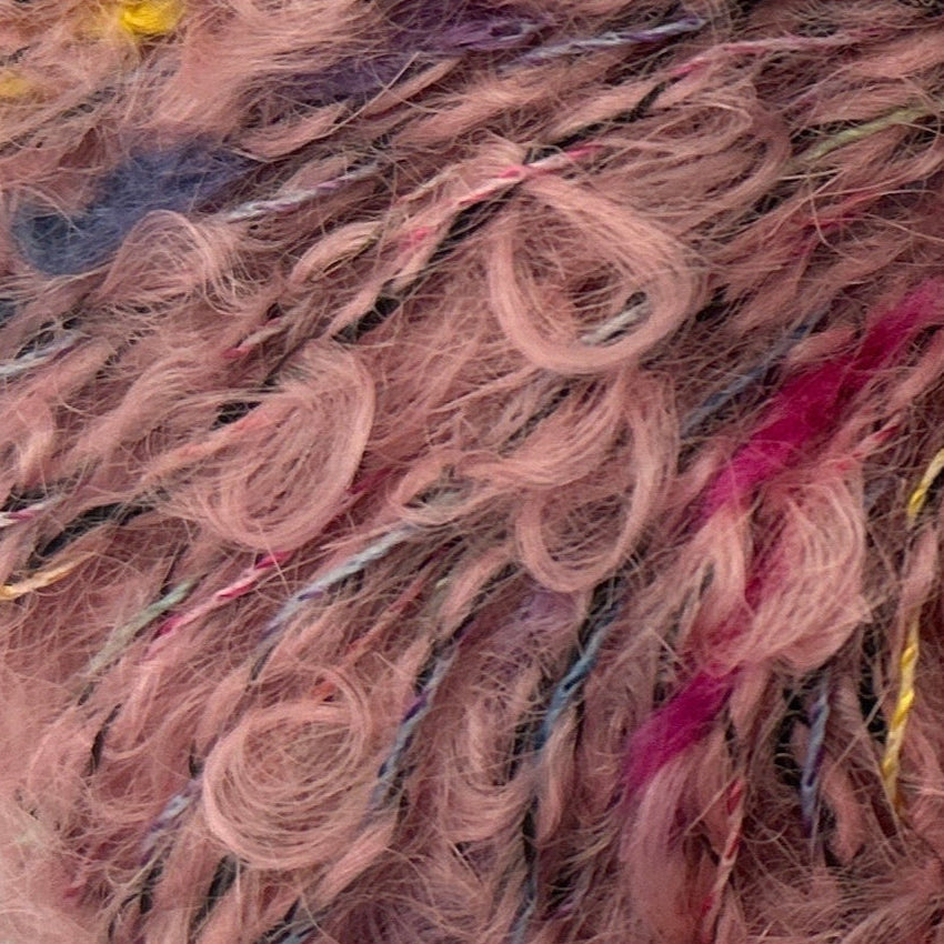 Close-up of pink and multicolored yarn strands