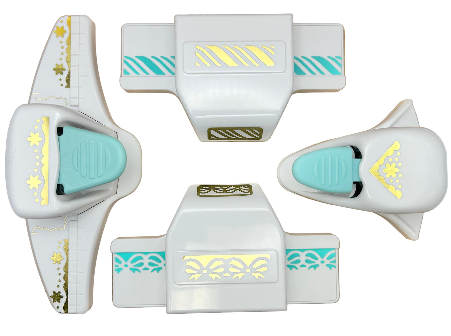 Set of white and turquoise cookie cutters with decorative patterns on a white background