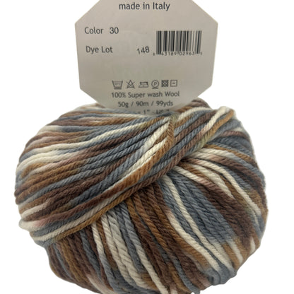 Multicolored skein of yarn with a label indicating 'made in Italy' on a white background.