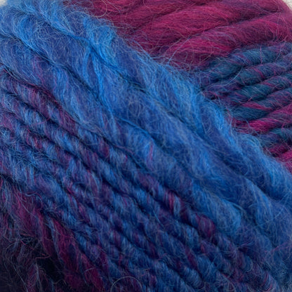 Blue and purple skein of yarn on a white background