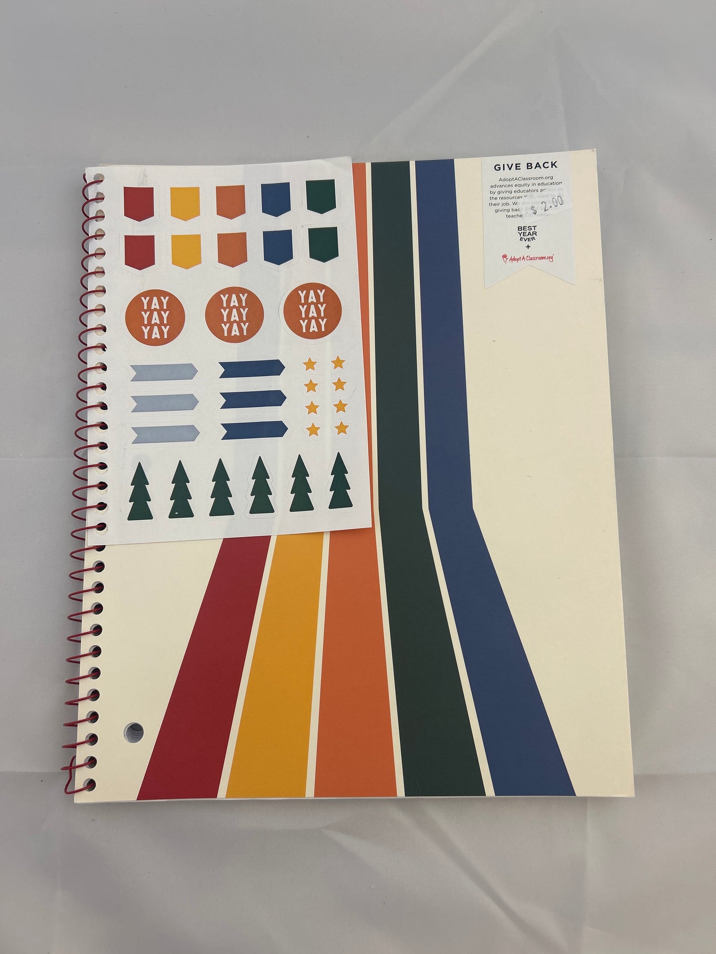 Notebook with colorful geometric design on a gray background