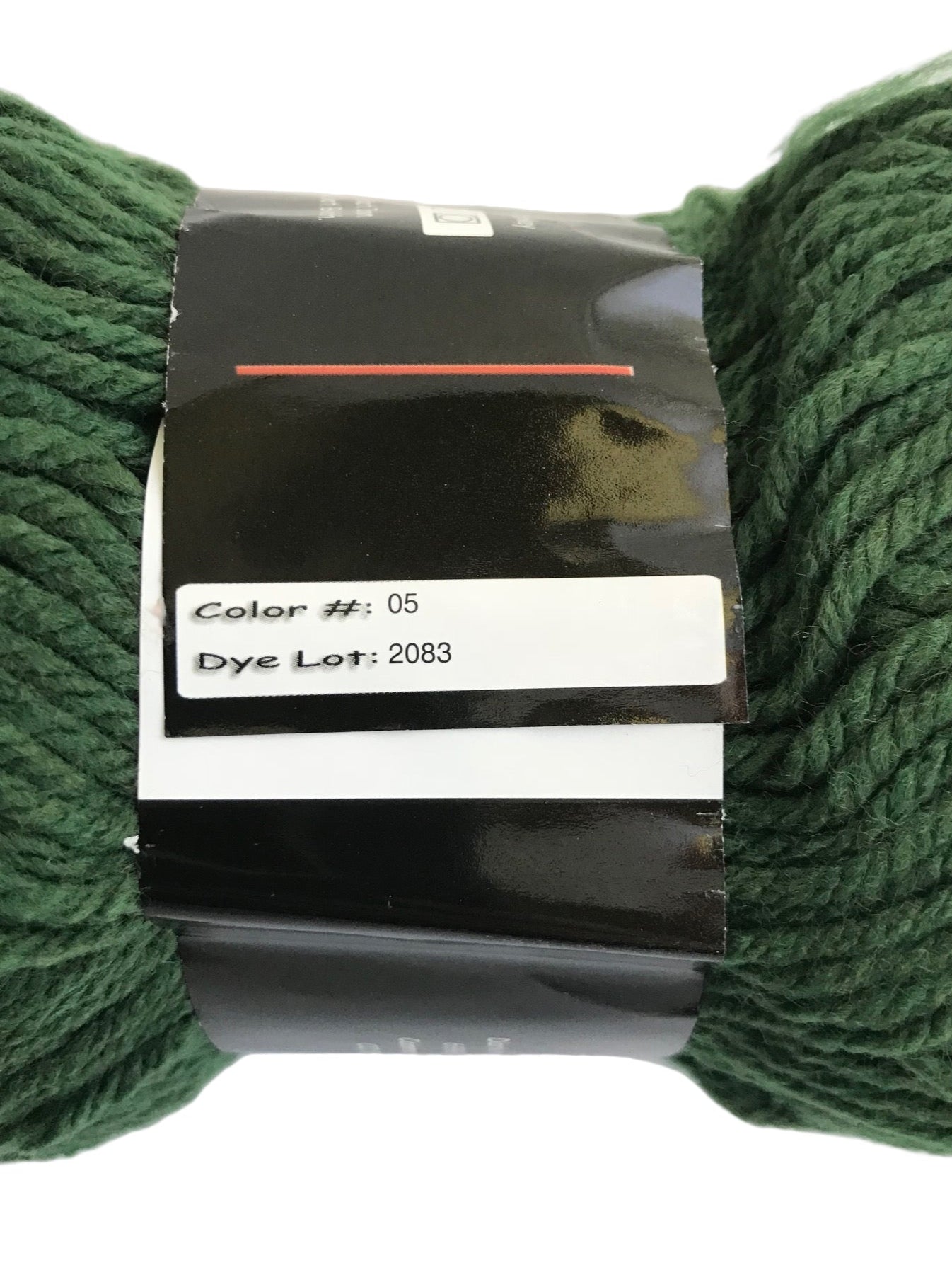 Green yarn with a label on a white background