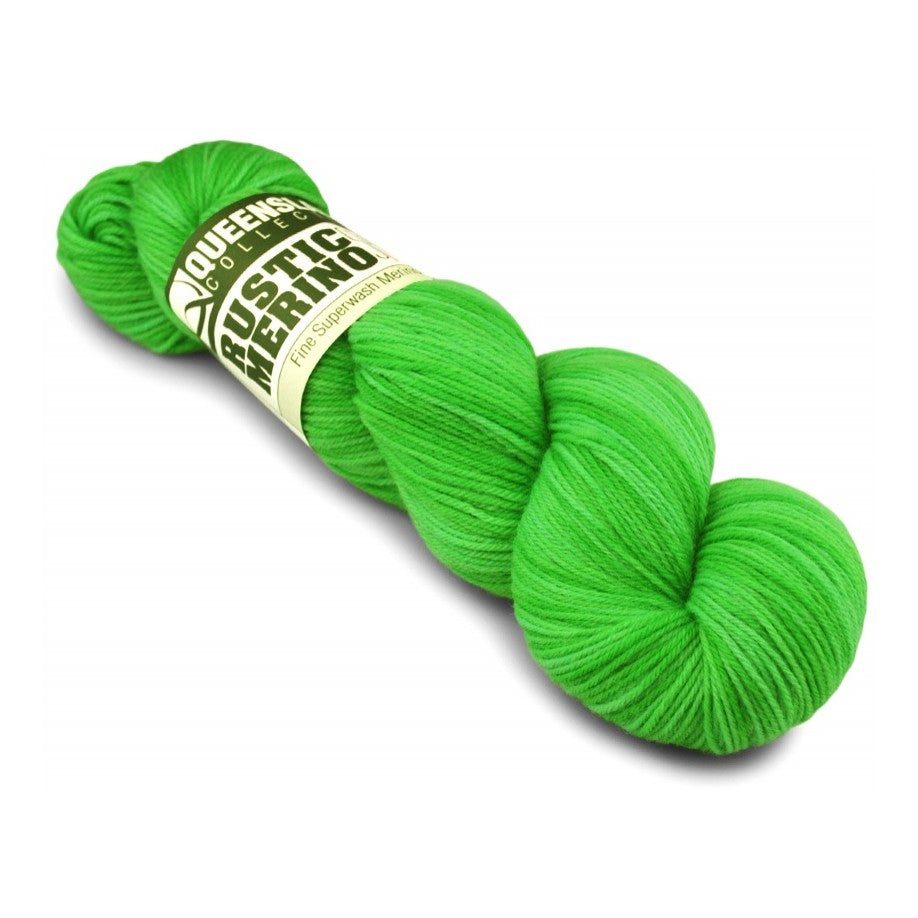 Green skein of yarn with a label on a white background