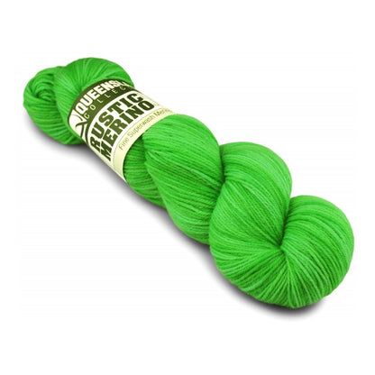 Green skein of yarn with a label on a white background