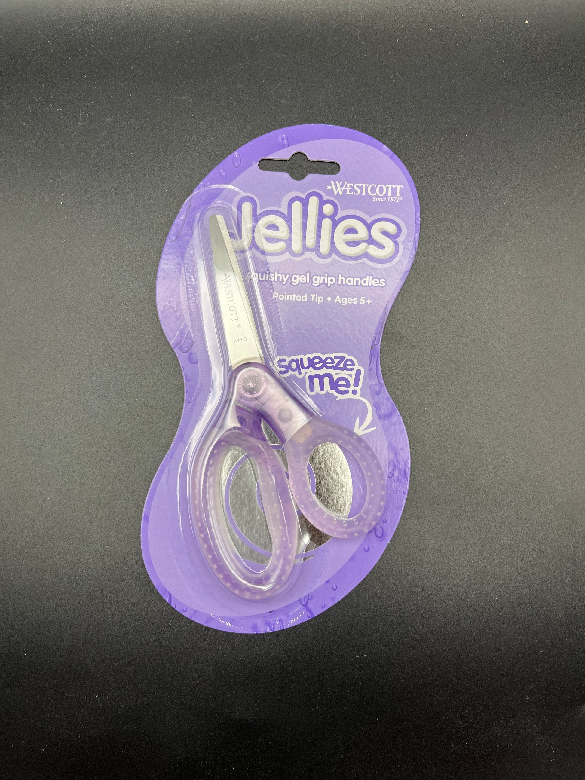 Purple packaging of a pair of baby scissors on a dark background