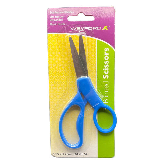 Pair of scissors with blue handles on a cardboard backing against a dark background