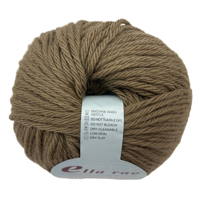 Ball of brown yarn with a label on a white background