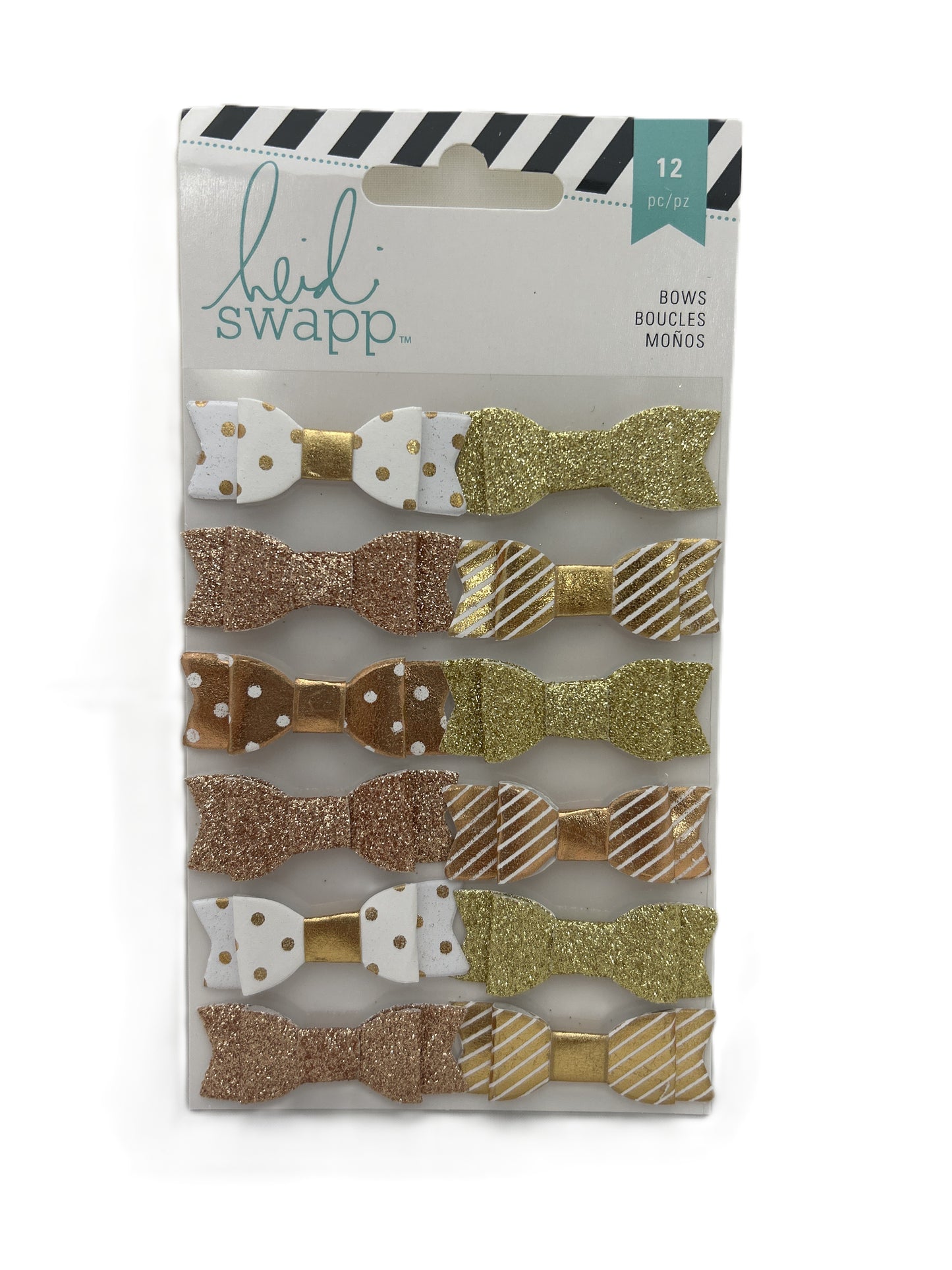 Packaged bow hair accessories with gold, bronze, and white designs on a white background.