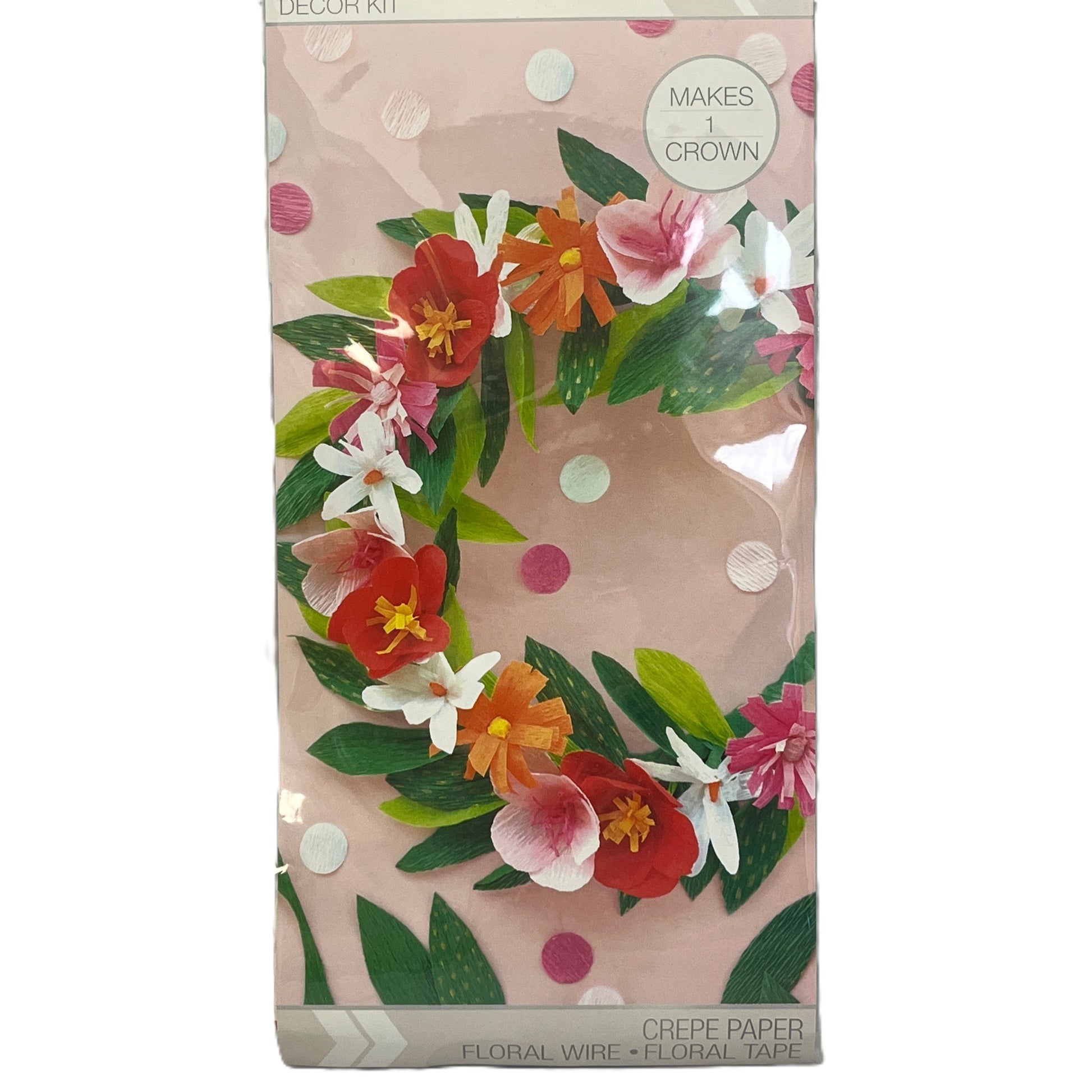 Floral wreath decor kit packaging with colorful flowers and green leaves on a pink background.