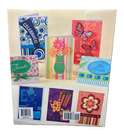 Assorted colorful greeting cards in a packaging sleeve with visible barcodes.