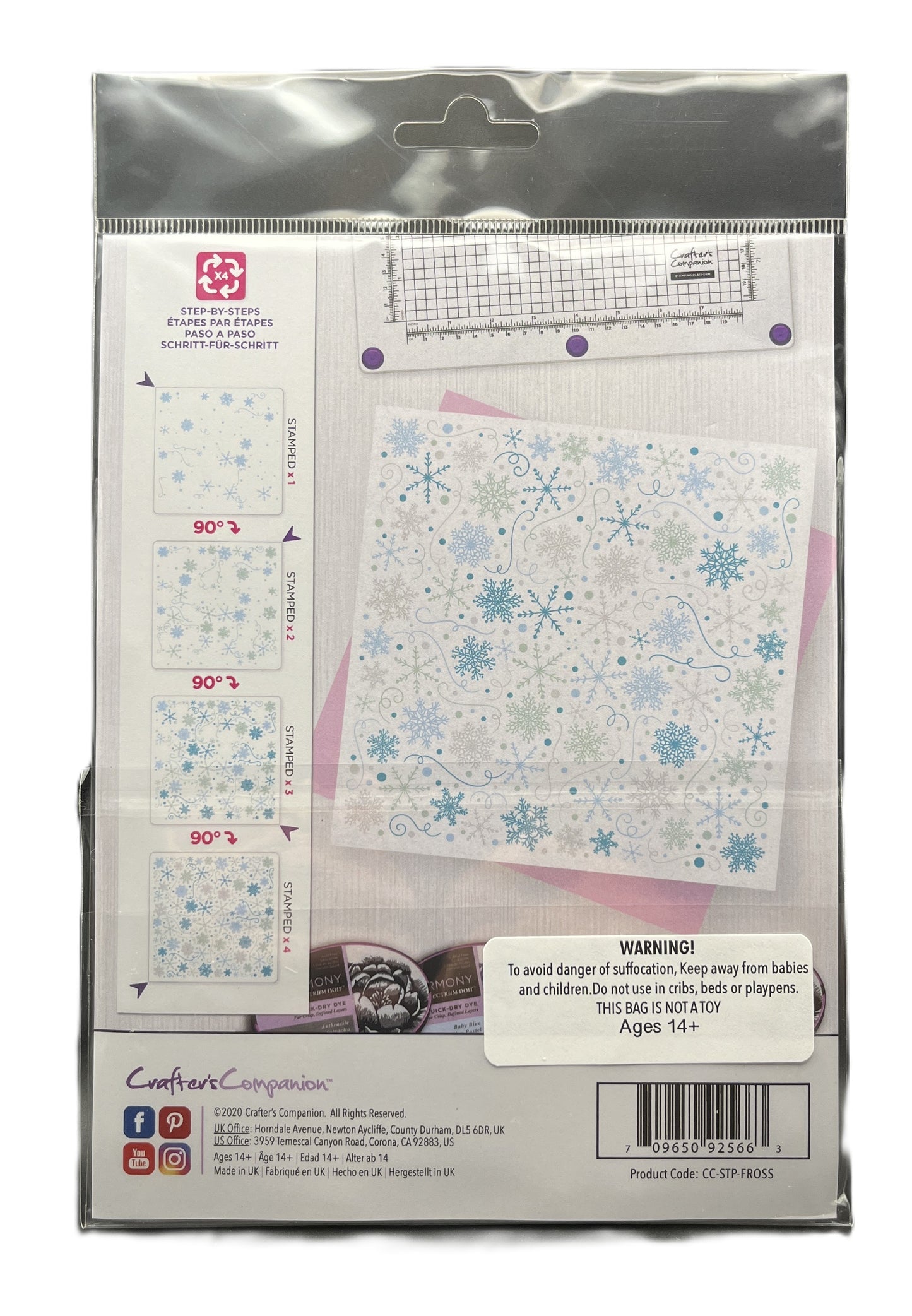 Package of cross-stitching fabric with snowflake patterns and a ruler on a white background.
