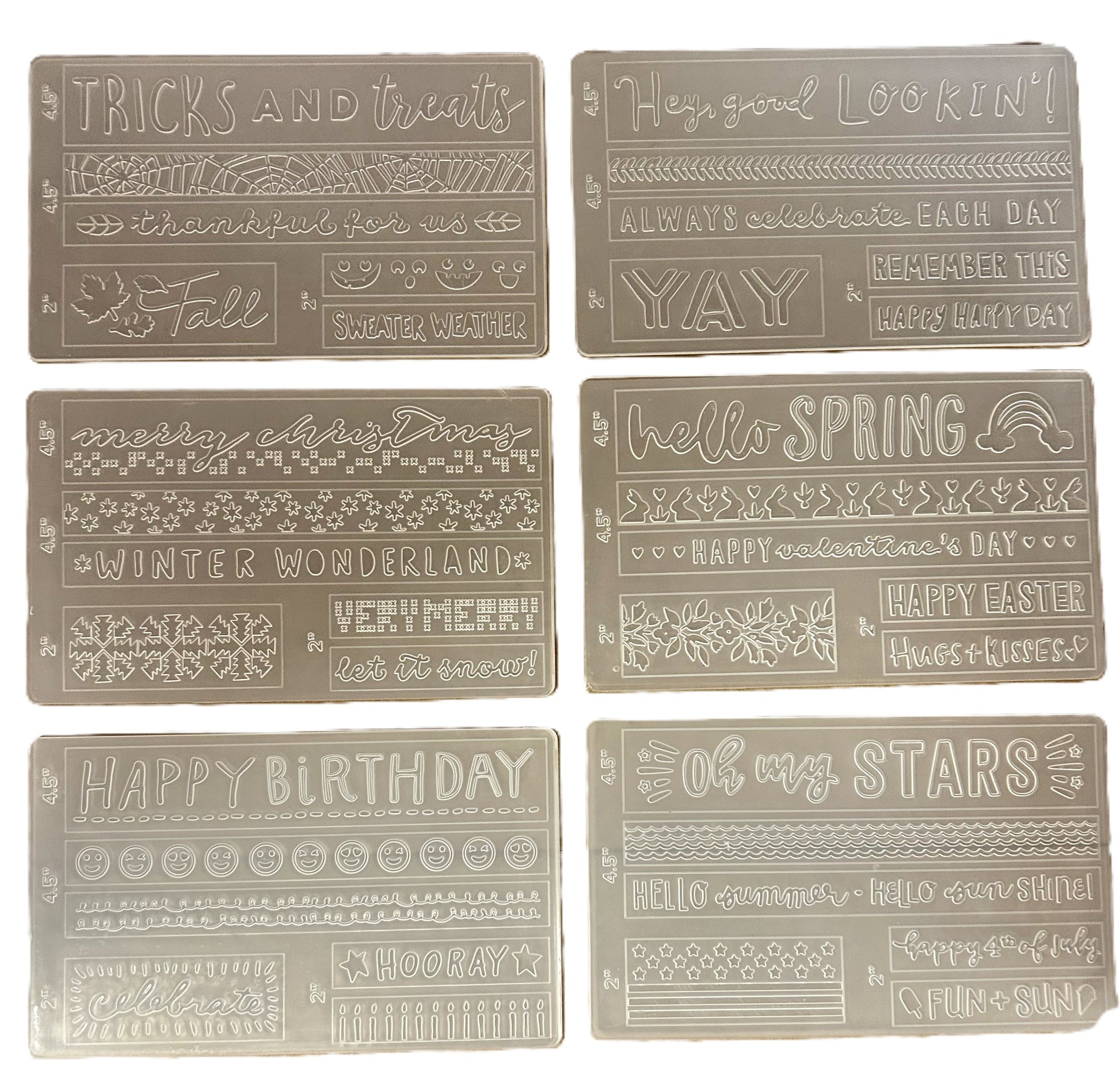 Set of decorative rectangular tiles with various text and patterns on a beige background