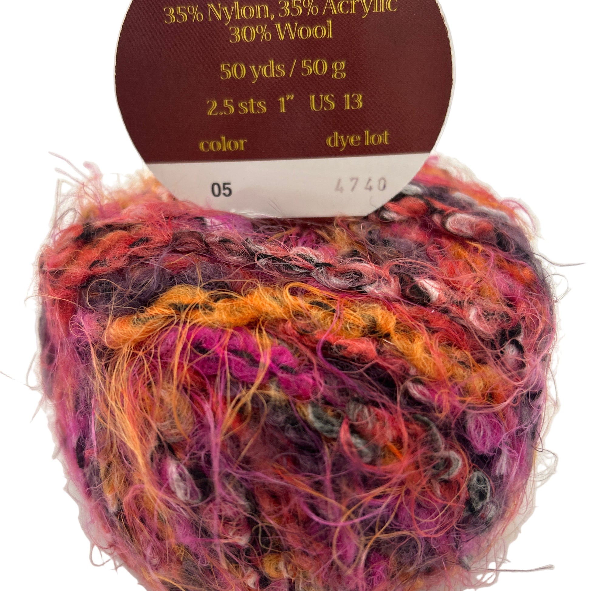Multicolored yarn ball with label indicating 'made in Italy' and fiber composition on a white background