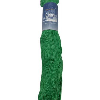 Green skein of yarn with a label on a white background