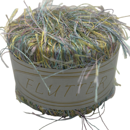 Ball of yarn with decorative elements on a light background
