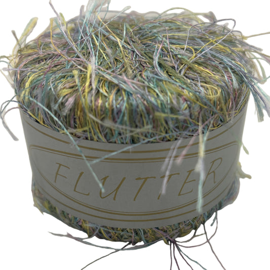 Ball of yarn with decorative elements on a light background