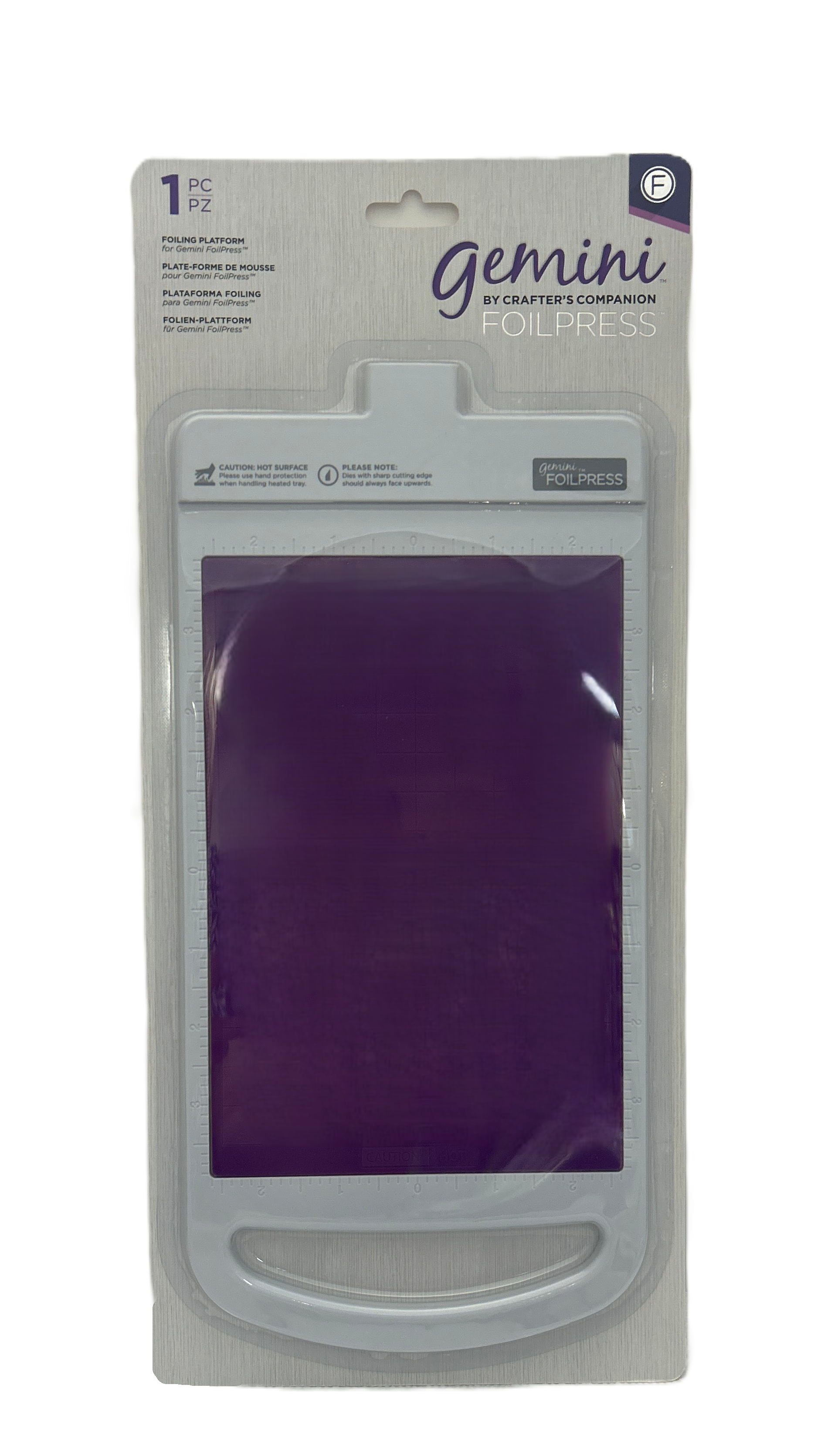 Packaged Gemini crafting tool with purple material inside on a white background