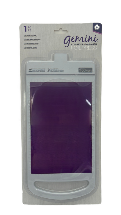 Packaged Gemini crafting tool with purple material inside on a white background