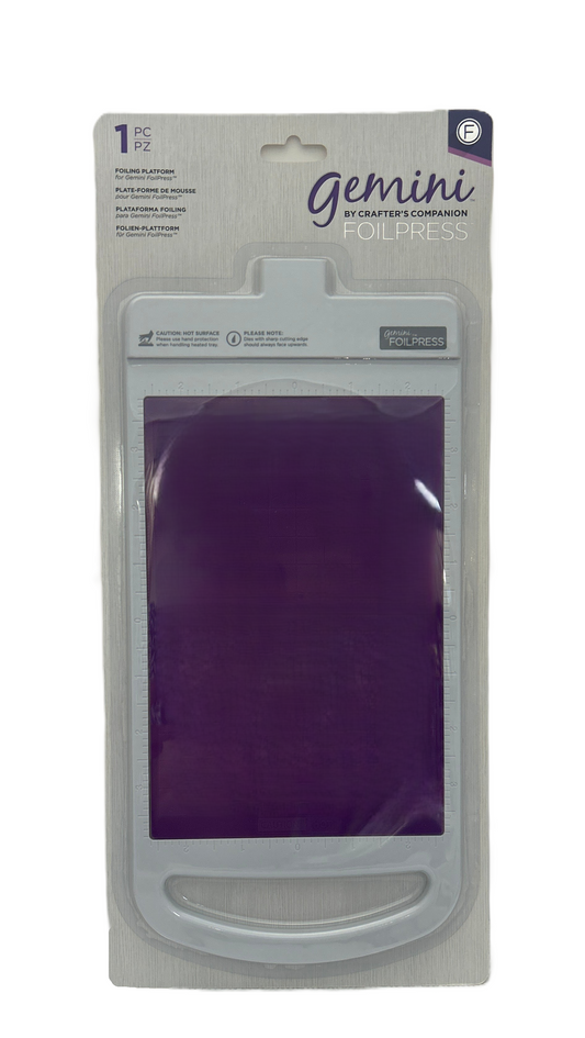 Packaged Gemini crafting tool with purple material inside on a white background