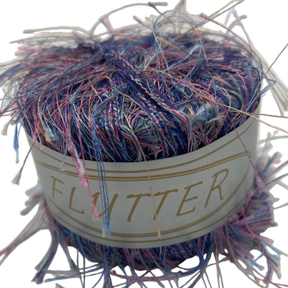 Multicolored yarn ball with 'Flutter' label on a white background