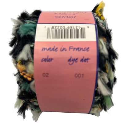 Yarn ball with a pink label indicating 'made in France' and 'color dye dot' on a white background