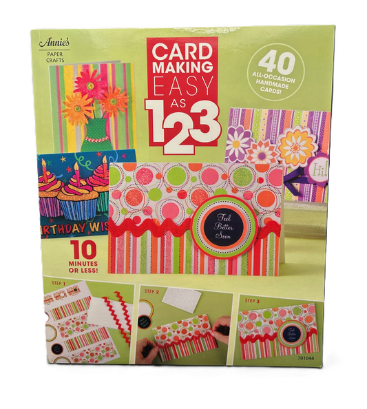 Card making kit packaging with colorful designs and text on a green background