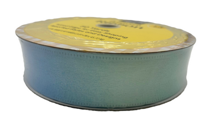 Spool of green ribbon with a yellow label on a white background