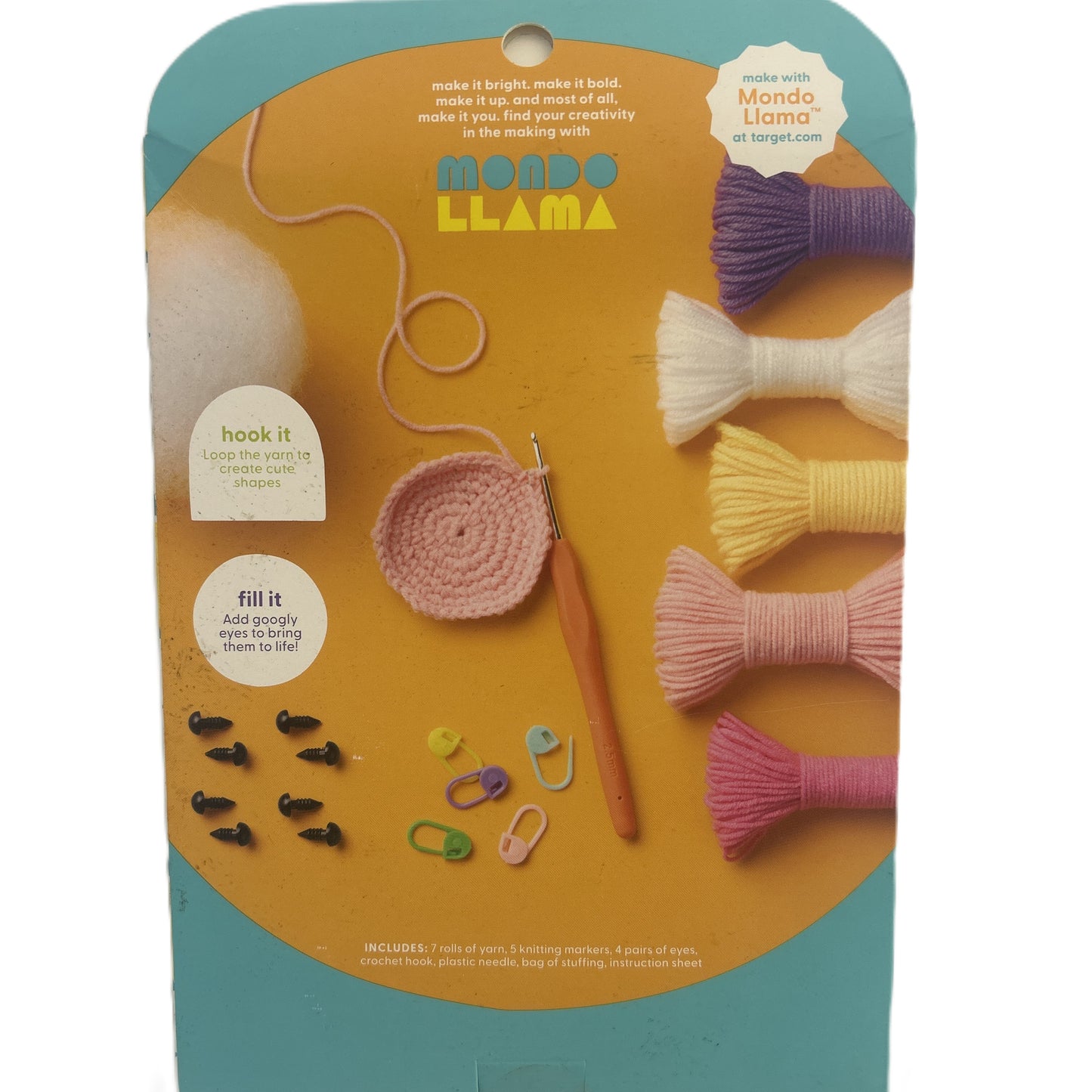 Mango Llama craft kit packaging with yarn, crochet hook, and accessories on a yellow and blue background.