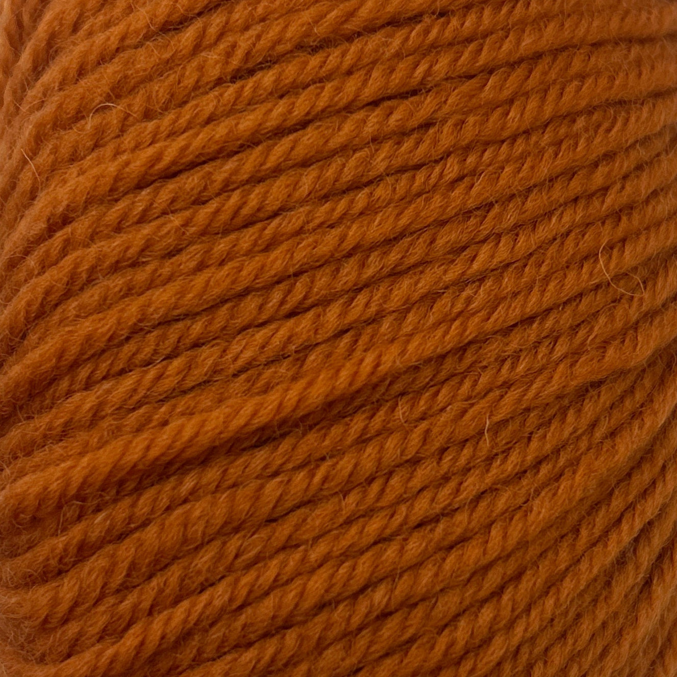 Close-up of a ball of orange yarn
