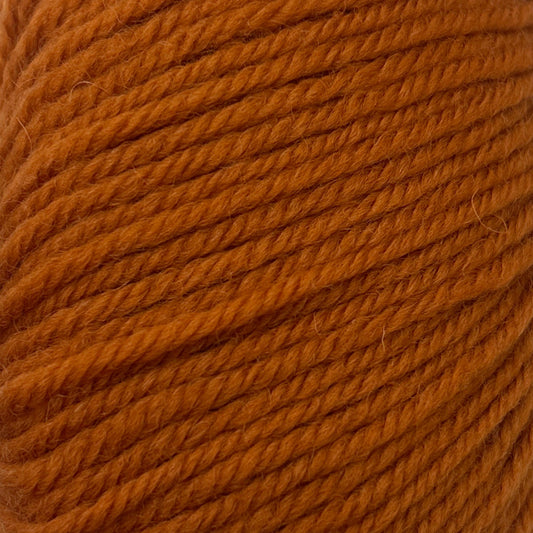 Close-up of a ball of orange yarn