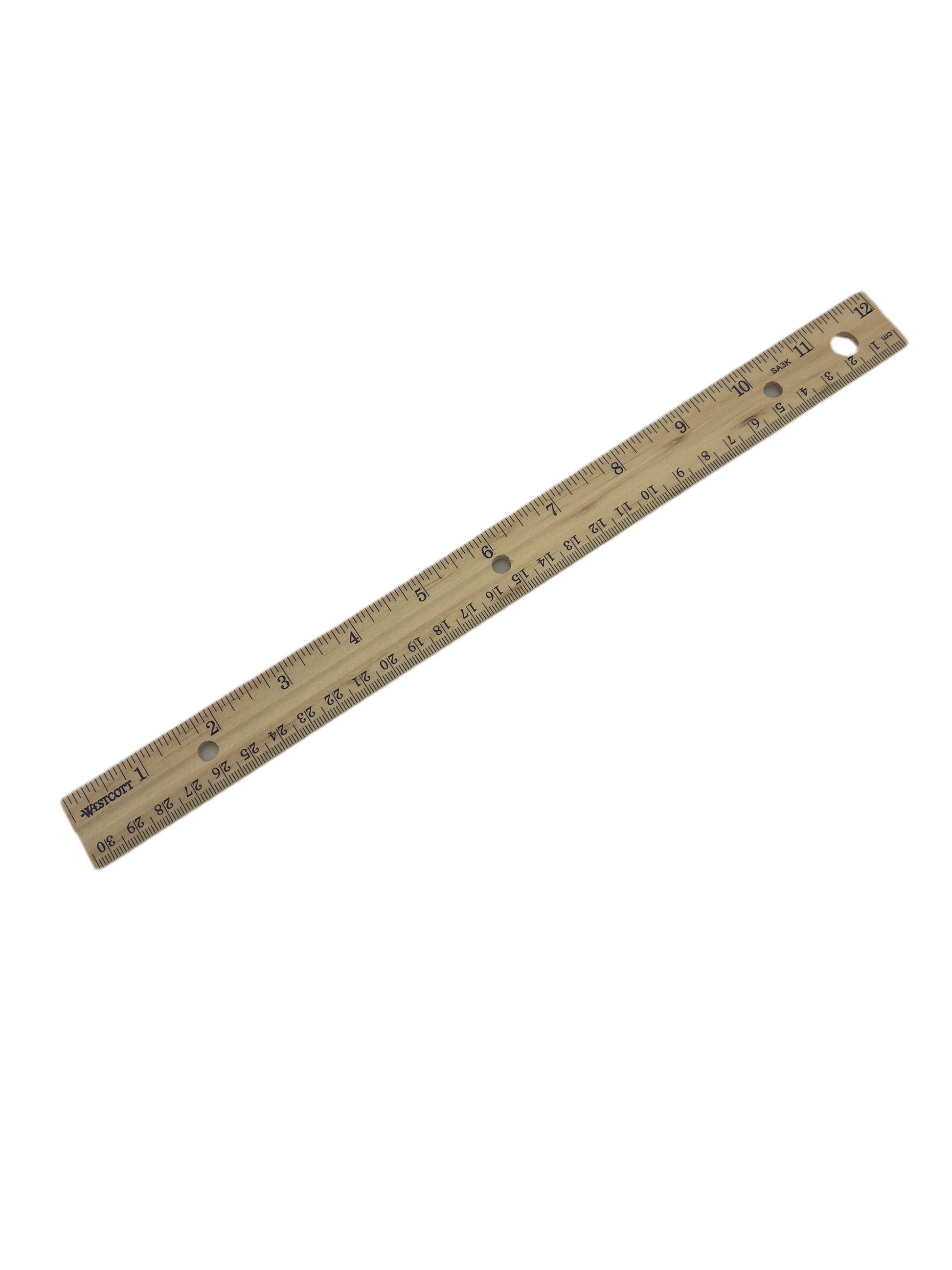 Wooden ruler with measurement markings on a white background