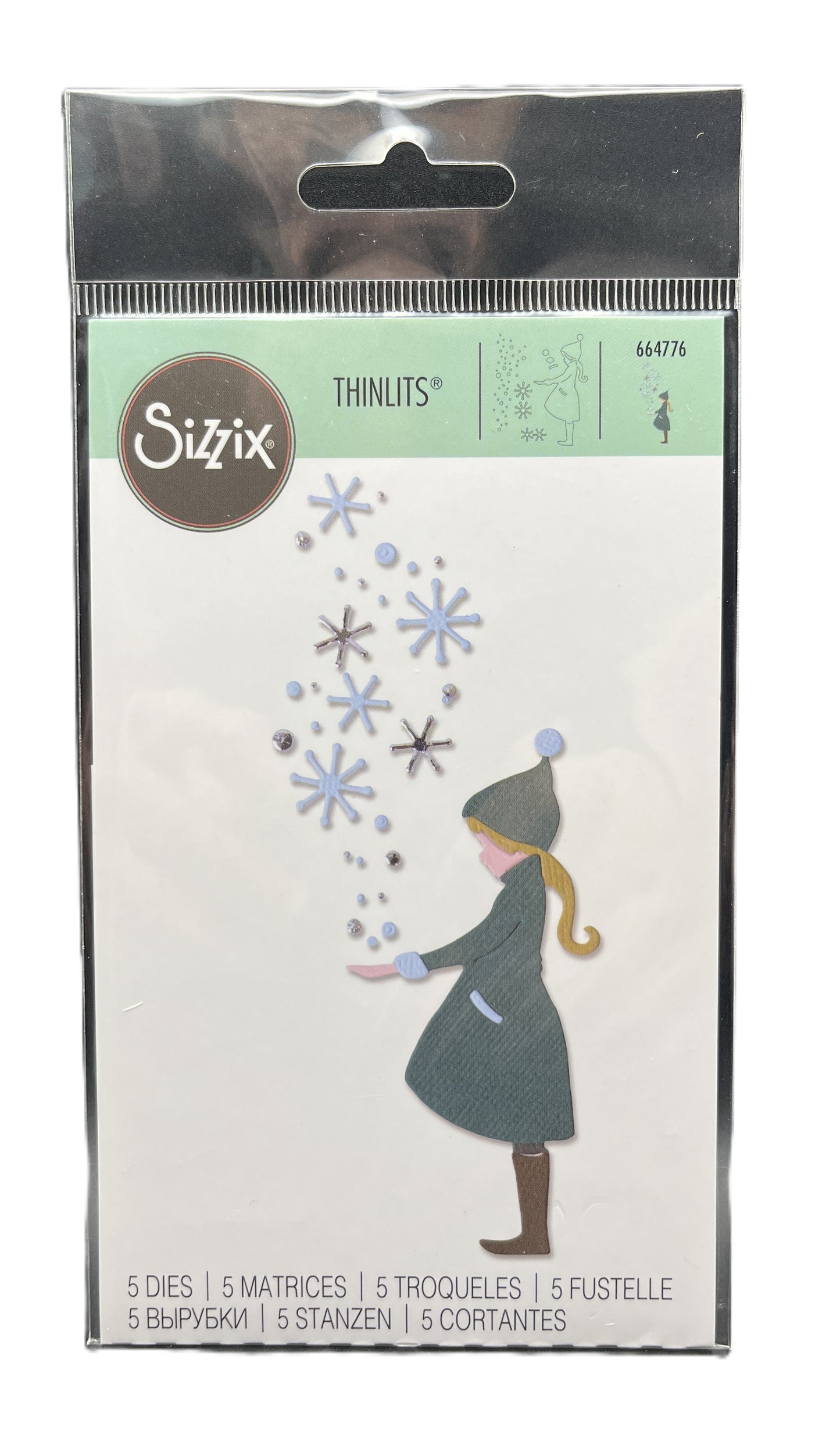 Sizzix Thinlits die set packaging with a girl and snowflakes design.