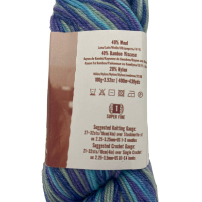Multicolored yarn skein with a label on a white background