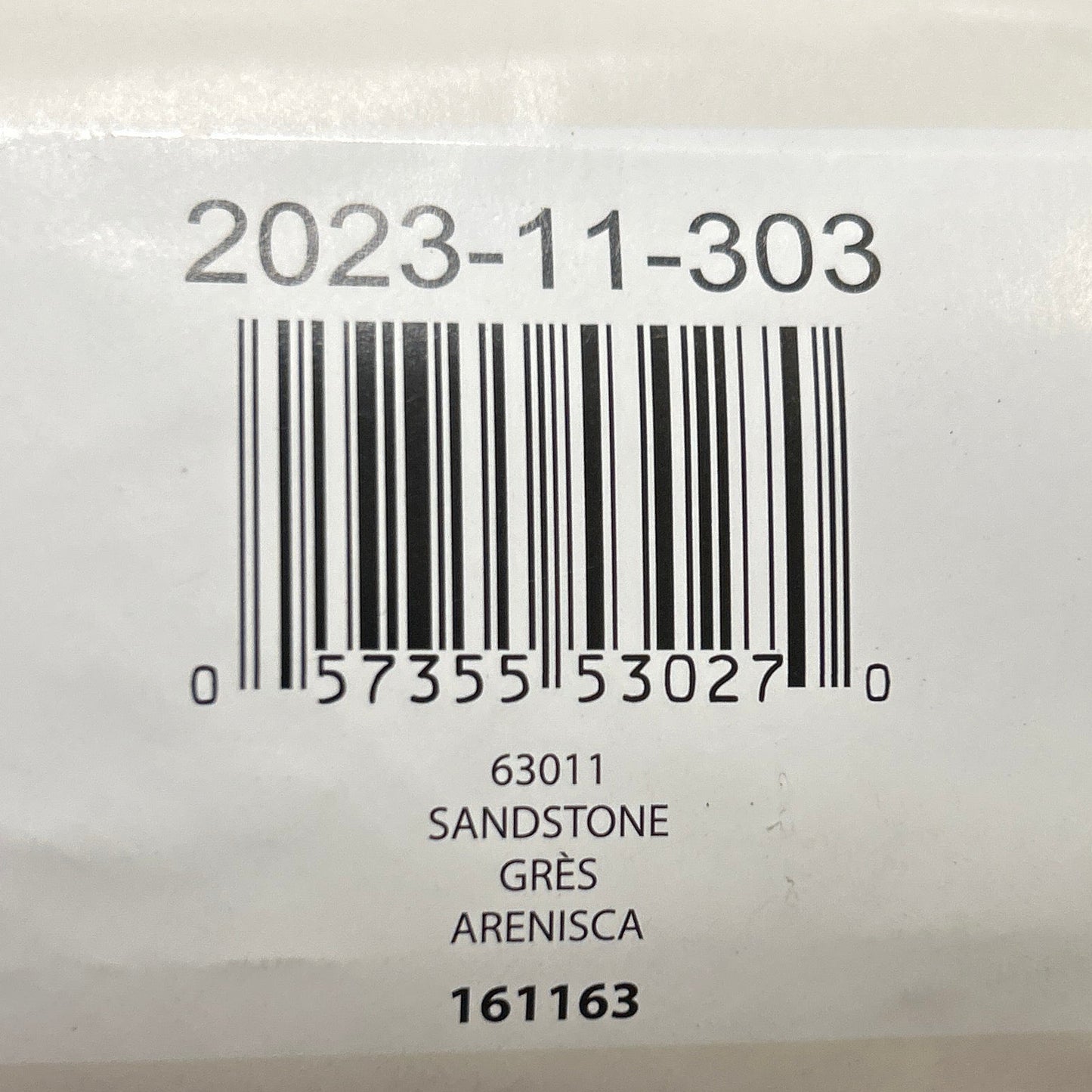 Yarn ball with a label showing a barcode and text