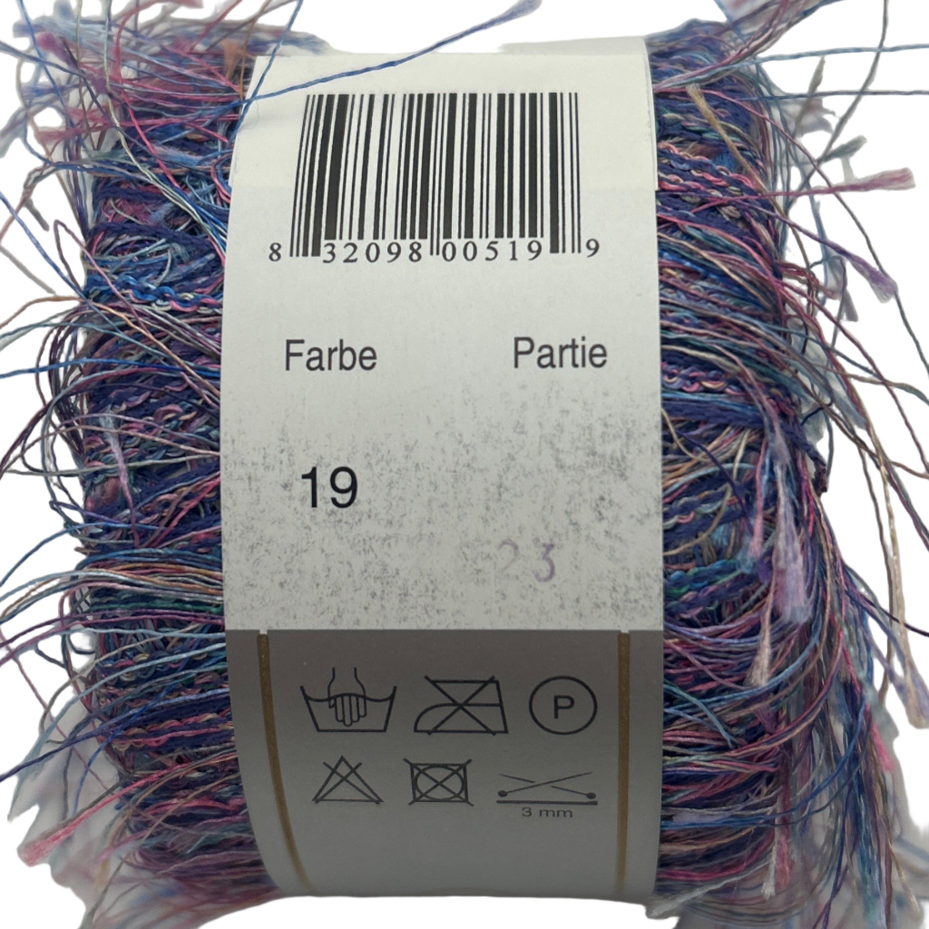Multicolored yarn ball with a label showing text and symbols