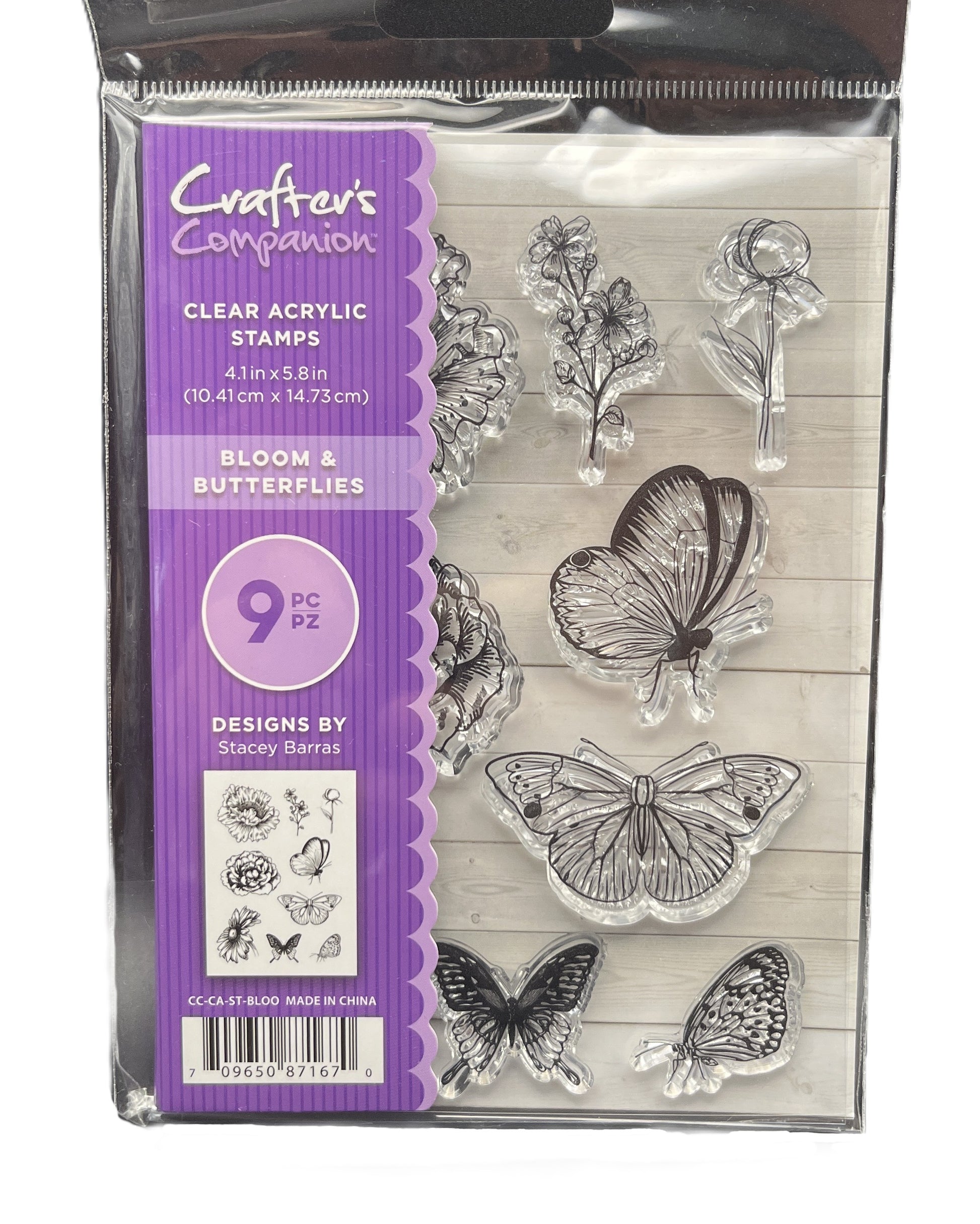Packaged clear acrylic stamps with butterflies and flowers, brand 'Crafters Companion' visible.