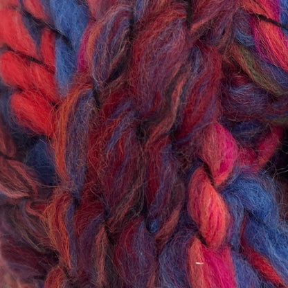 Close-up of multicolored yarn with red, blue, and pink hues.